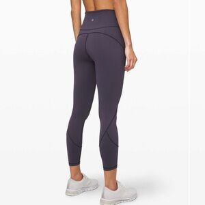 Lululemon in movement purple tight leggings 25” size 4